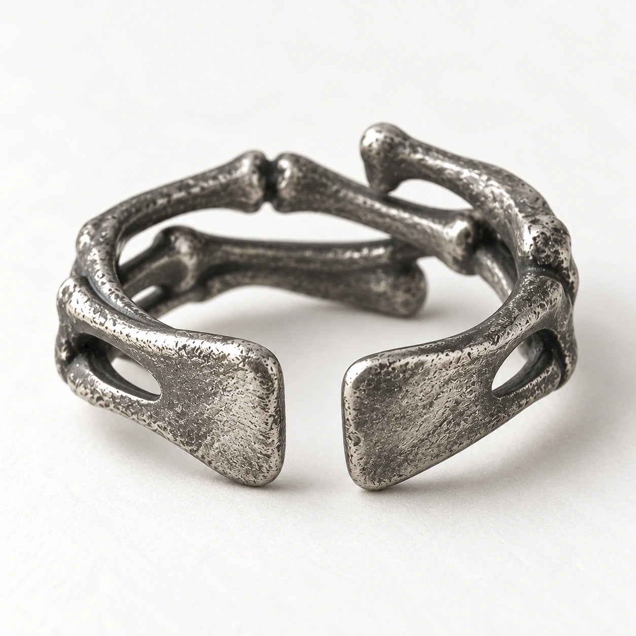 Rear view of the Bone Ring showing two rounded open ends and curved silver rails